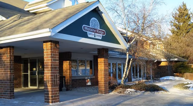 Exterior view of Moraine Ridge Senior Living entrance with brick columns