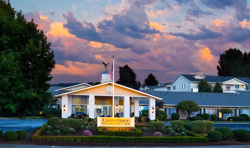 Exterior view of Canterbury Inn Assisted Living Community front entrance with landscaped garden.