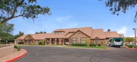 Exterior view of Brookdale Chandler Ray Road, a brick senior living facility with parking.
