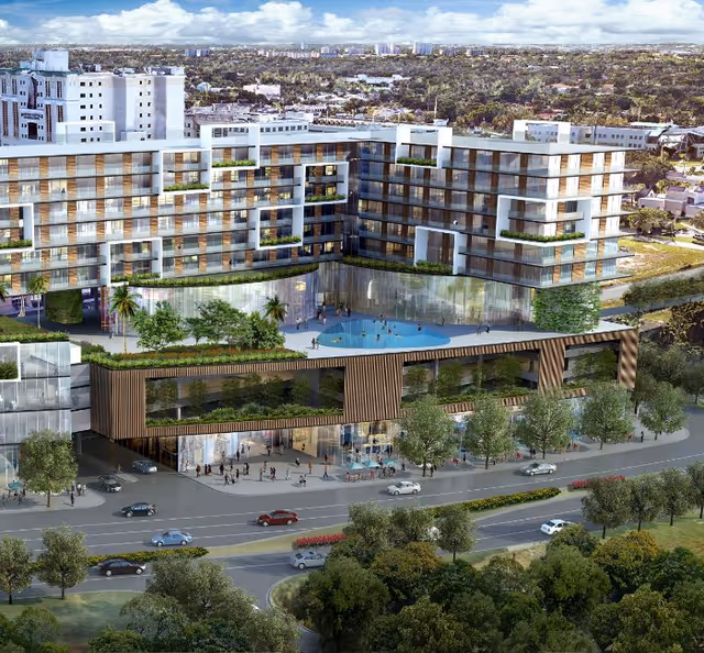 A modern multi-story senior living building with a central glass-front entrance and pool terrace.