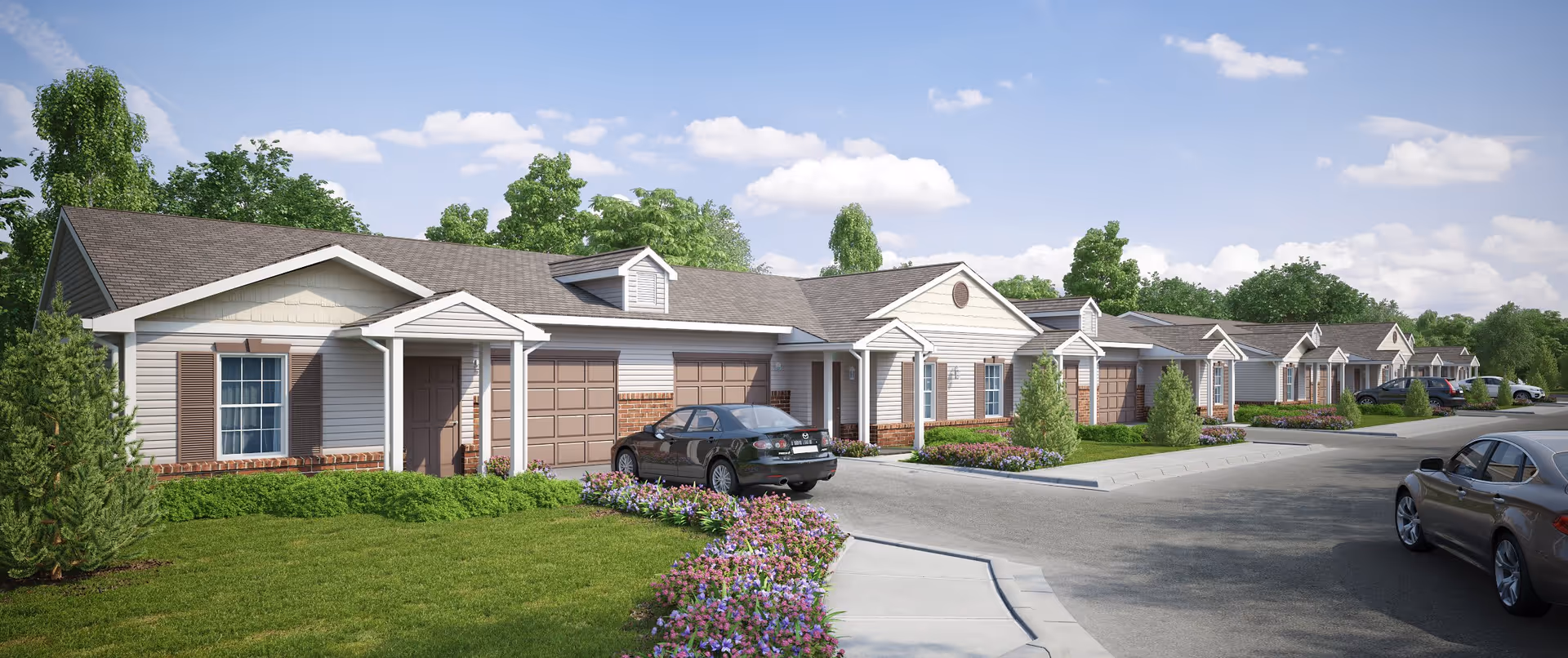 Exterior view of a senior living facility named The Reserve at Lakeview Landing showing a row of single-story residential units with garages, cars parked in front, well-maintained lawns, flower beds, and trees under a partly cloudy sky.