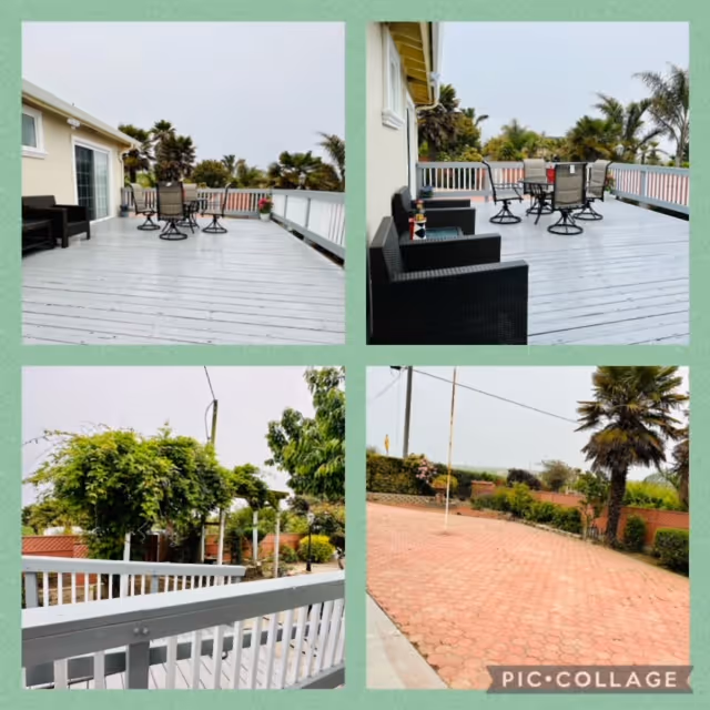 Collage of four images showing outdoor areas of a facility. The top two images show a spacious wooden deck with patio furniture including chairs and tables, surrounded by white railings and palm trees in the background. The bottom left image shows a white railing with greenery and trees beyond it. The bottom right image shows a paved courtyard area with a palm tree, bushes, and a flagpole, under an overcast sky.