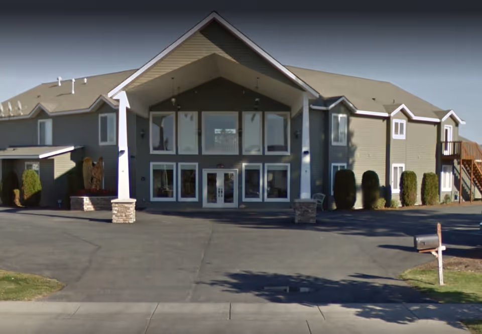 Front exterior of Generations Memory Care building with large glass entrance doors.