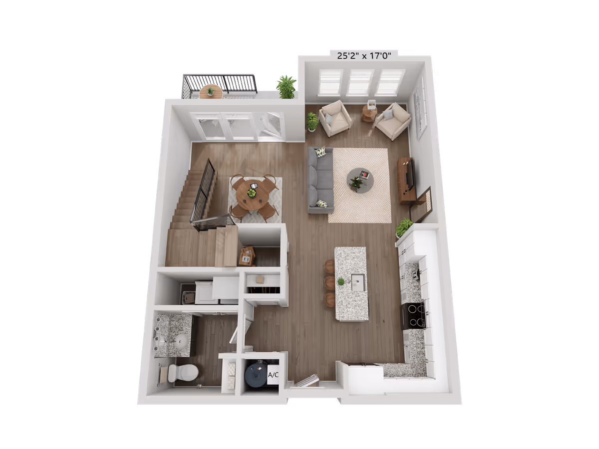 3D floor plan of a residential unit showing an open living room with a sofa, two armchairs, a coffee table, and a TV stand. Adjacent to the living room is a kitchen with an island and three bar stools. There is a dining area with a round table and four chairs near a staircase leading to another floor. The unit also includes a bathroom with a toilet and sink, a laundry area with a washer and dryer, and an A/C closet. A small balcony with a table and plant is accessible through glass doors.