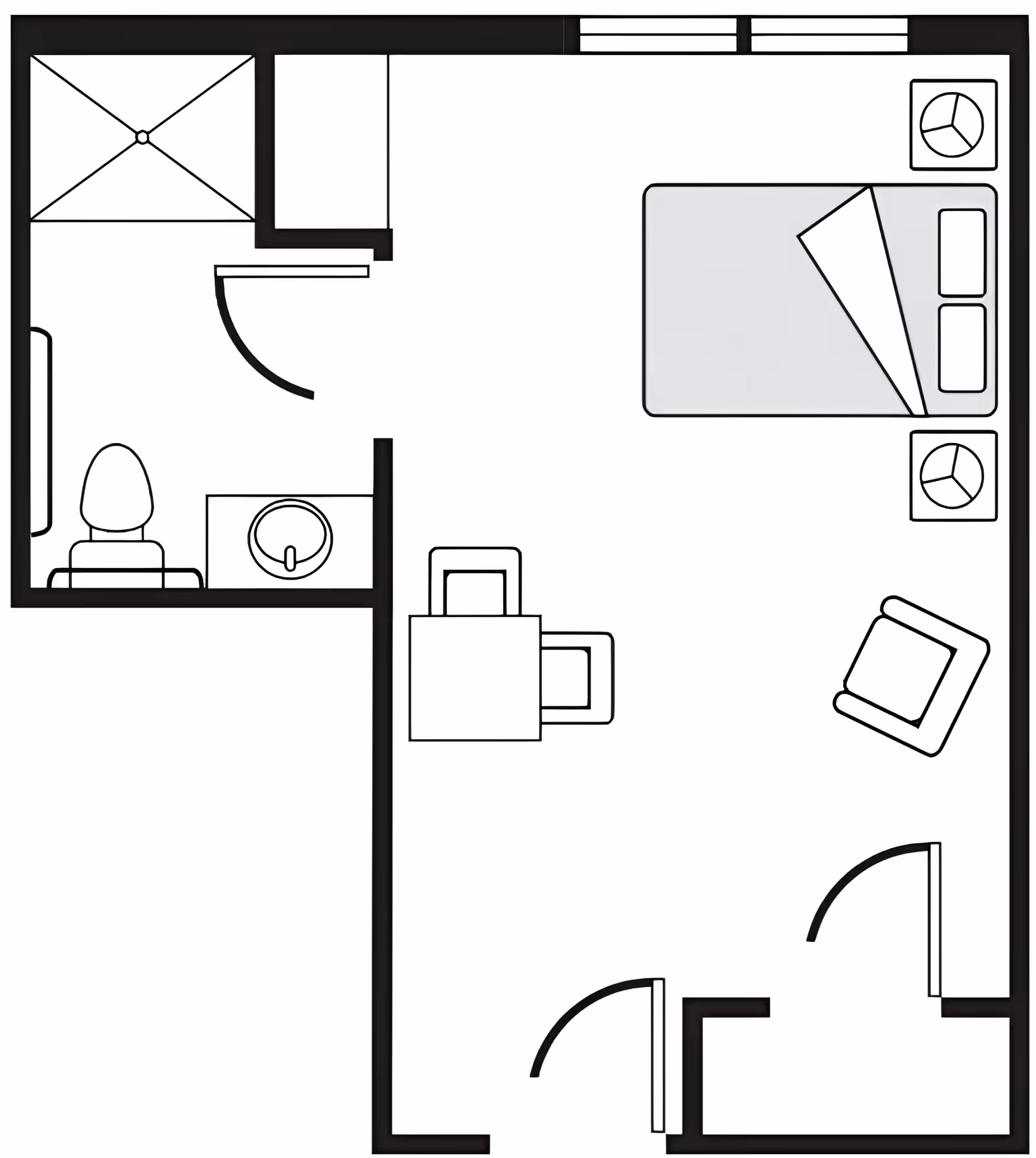 Floor plan of a small living space with a bedroom area containing a bed, two nightstands, and a chair. There is a small dining table with two chairs in the center. The bathroom includes a shower, toilet, and sink.