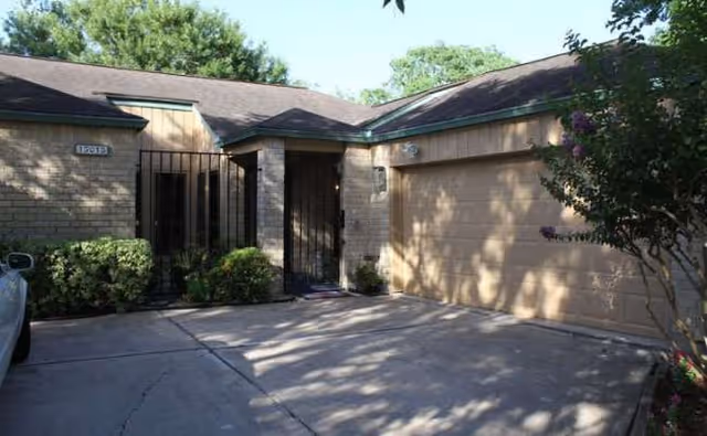 Exterior view of Light Heart Memory Care Webster, a single-story facility with a driveway.