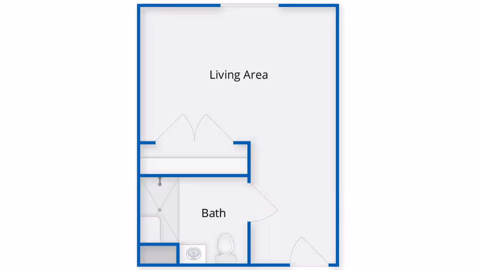 Floor plan layout showing a living area and a bathroom with a shower, toilet, and sink.