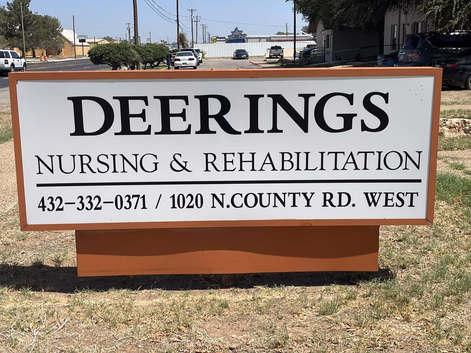 Sign for Deerings Nursing and Rehabilitation, displaying contact information and address.