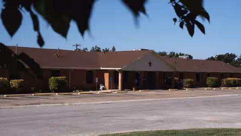 Front exterior of Concho Health and Rehabilitation Center, a single-story building with a parking lot.
