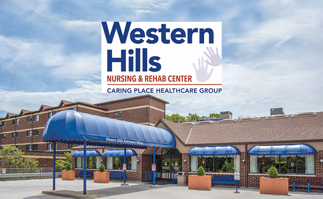Exterior view of Western Hills Nursing & Rehab Center building with blue awnings over the entrance and windows, surrounded by planters and a partly cloudy sky.