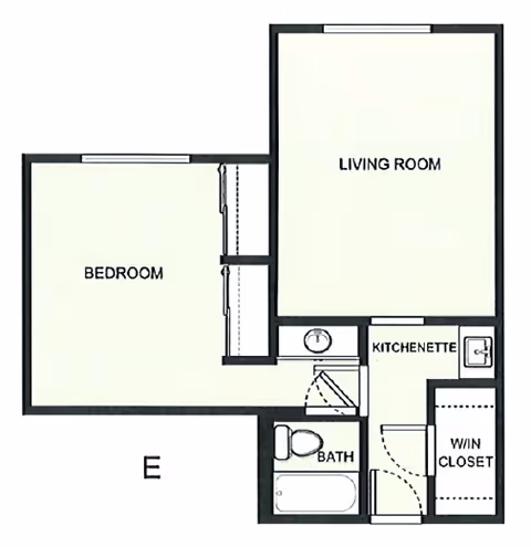 Architectural floor plan of a retirement inn unit showing a bedroom, living room, kitchenette, bathroom, and walk-in closet.