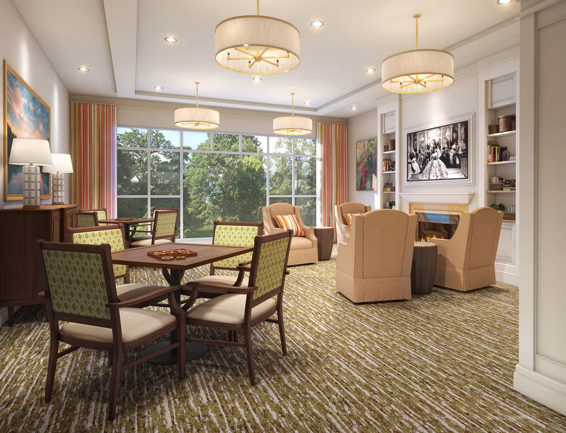 A bright and spacious living room area with large windows showing green trees outside. The room features a carpeted floor, several armchairs arranged around a fireplace with a black and white photo above it, and a wooden table with four chairs in the foreground. The walls have built-in shelves with books and decorative items, and there are three modern pendant lights hanging from the ceiling.
