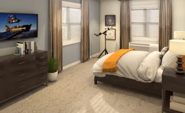 A bright furnished bedroom featuring a bed with a yellow throw, a dresser with a TV, windows with blinds, and a telescope by the window.