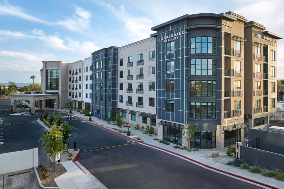 Exterior view of Clarendale Arcadia senior living building with modern glass façade