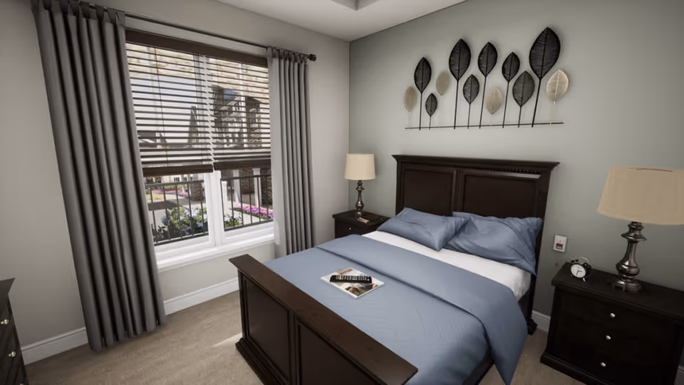 Bedroom featuring a dark wood bed with blue bedding, matching nightstands and lamps, decorative wall art, and a curtained window.