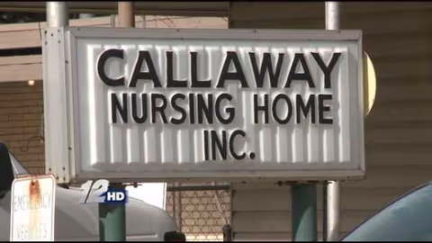 Exterior view of a CALLAWAY NURSING HOME INC. sign on a building front.