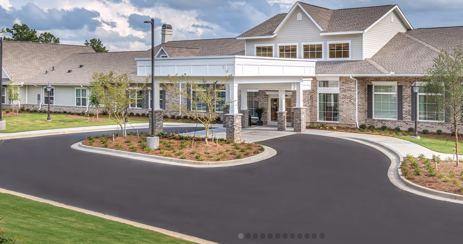 Thrive at Green Island exterior with curved driveway and covered entrance.