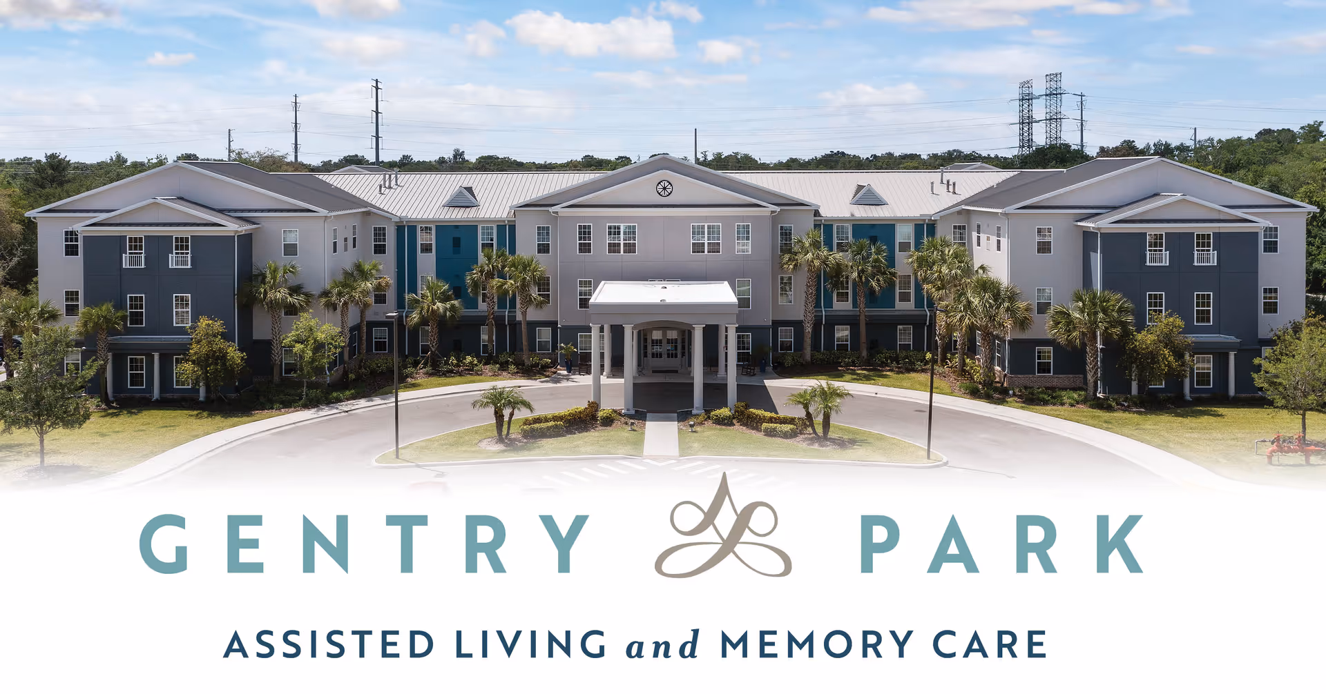 Front exterior of Gentry Park assisted living and memory care building with entrance canopy, driveway, and palm trees.