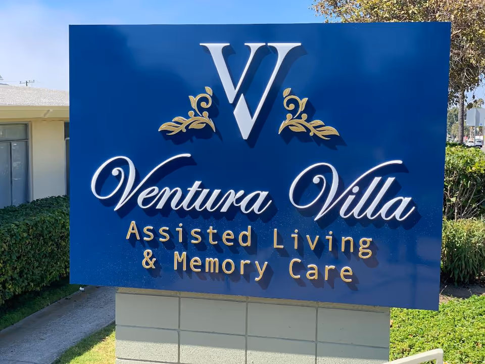 Blue Ventura Villa Assisted Living sign with Memory Care text outside the facility.
