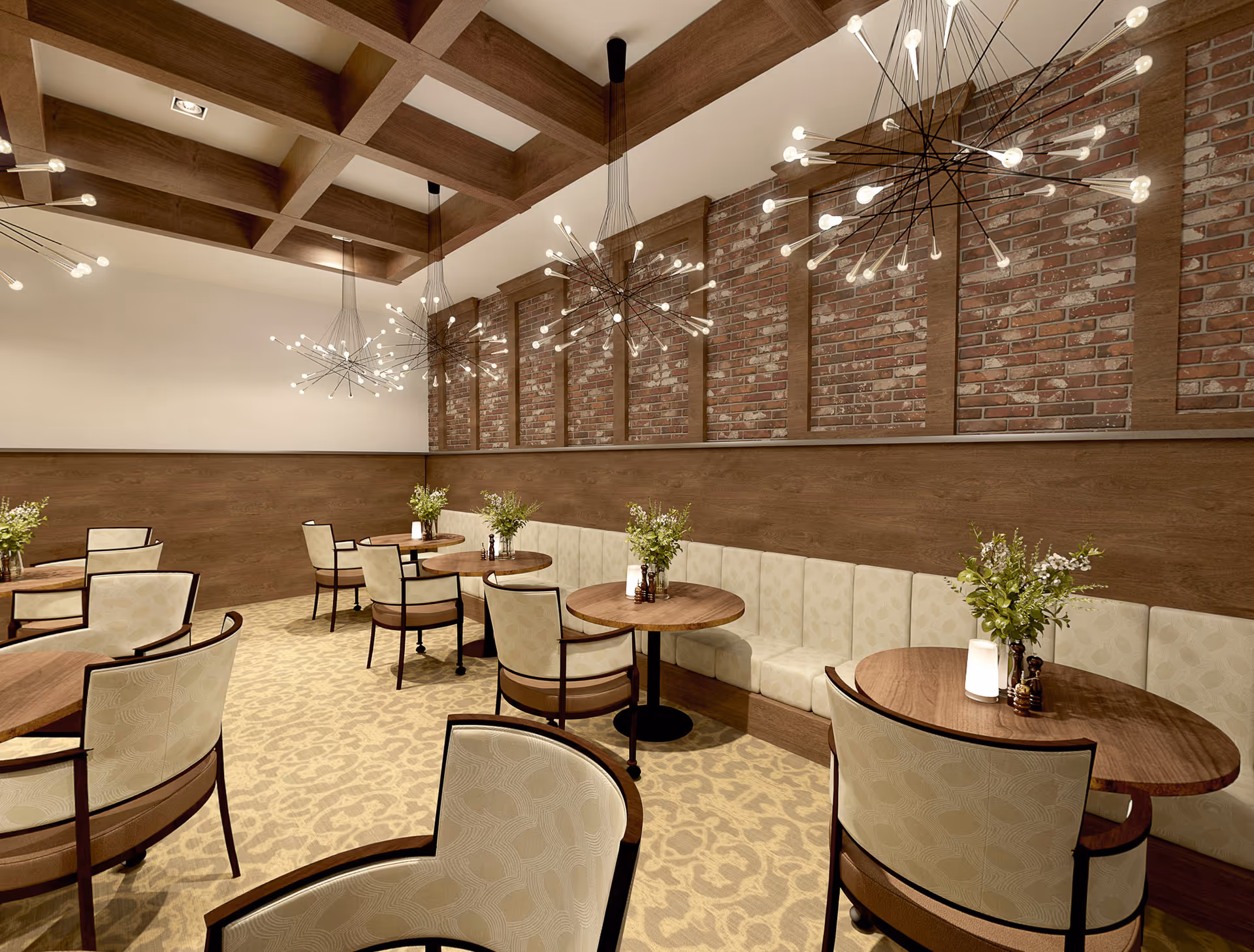 Elegant dining room with round wooden tables, upholstered chairs and banquette seating beneath brick accent walls and modern starburst chandeliers.