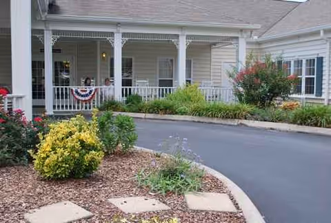 Front exterior of Morning Pointe of Greeneville with a covered porch and landscaped entrance.
