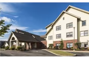 Exterior view of Presbyterian SeniorCare Network Southmont building with driveway and entrance.