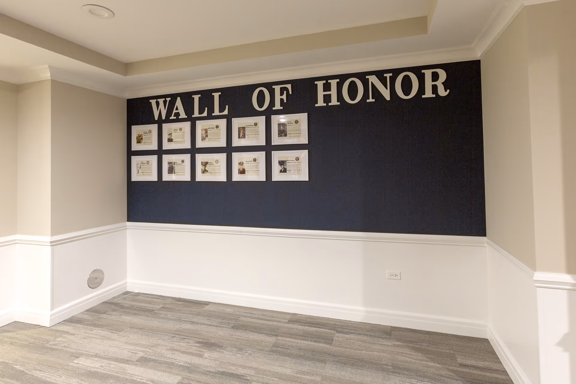 Interior wall display labeled 'WALL OF HONOR' featuring framed photos and certificates.