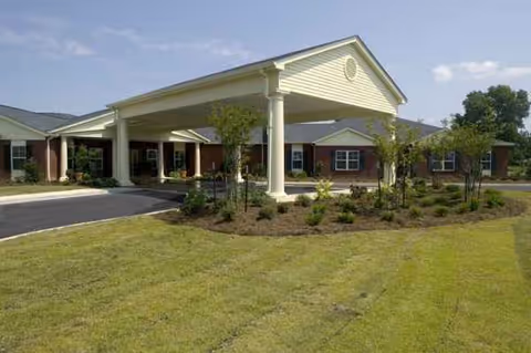 Front view of Crystal Rehabilitation and Healthcare Center entrance with porte-cochère and landscaping.