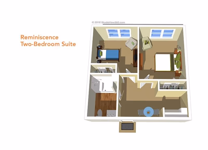 3D floor plan of a Reminiscence Two-Bedroom Suite showing two bedrooms, a bathroom with shower and toilet, a living area with a chair and TV, and a dining area with a round table and chairs.