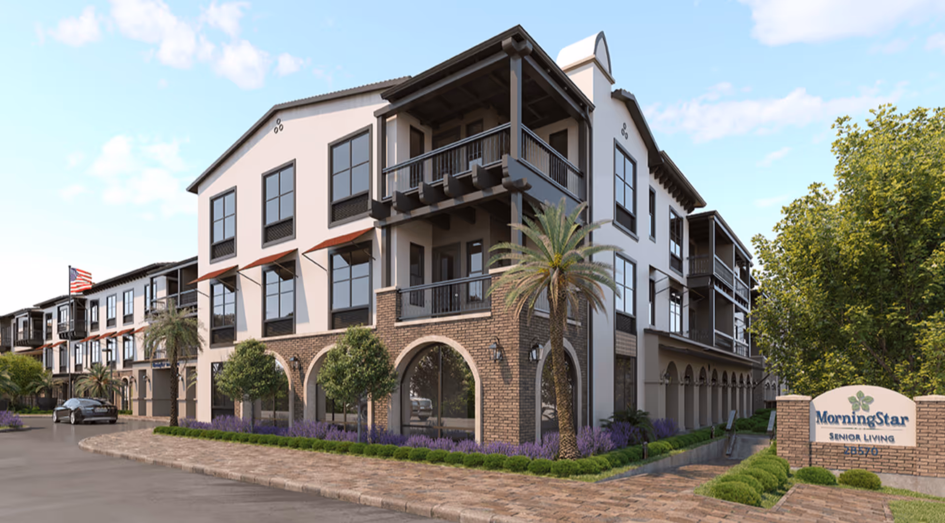 Front exterior of a three-story MorningStar Senior Living building with balconies, arched brickwork, landscaping, and a sign.