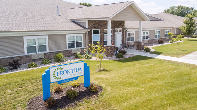 Frontida Adelaide Place sign in front of a single-story assisted living facility.