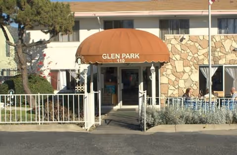 Exterior view of Glen Park at Monrovia entrance with orange awning and walkway.