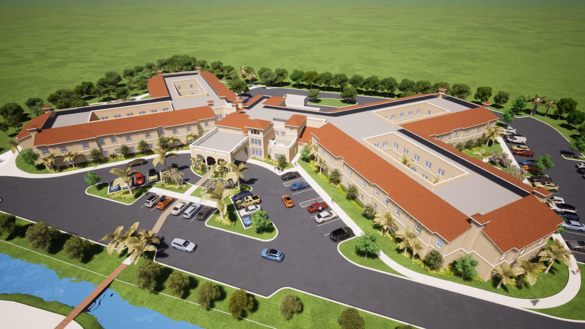 Aerial view of Sunscape Boca Raton senior living facility showing a large, U-shaped building with red-tiled roofs surrounded by landscaped greenery, parking lots with cars, and a small water body with a wooden bridge.
