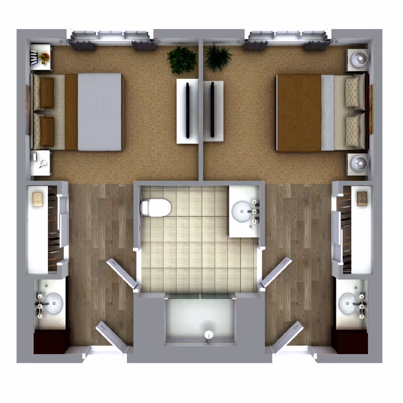 Top-down floor plan of a living space featuring two bedrooms, each with a bed, nightstands, and a TV mounted on a stand. Between the bedrooms is a shared bathroom with a toilet, sink, and shower. Each bedroom has an adjacent area with a sink and storage space.
