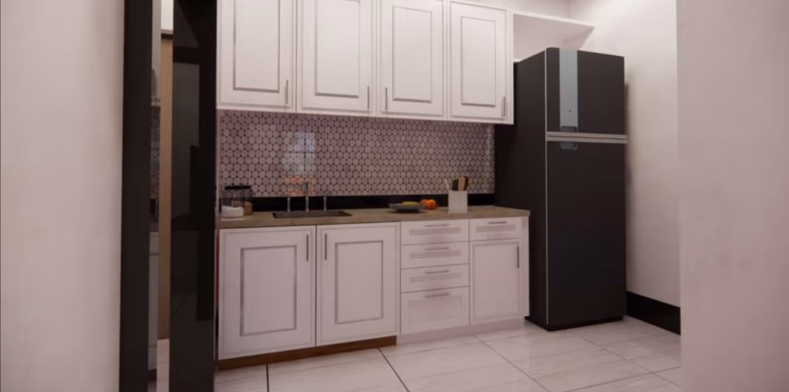 A modern kitchen with white cabinetry, a black refrigerator, a countertop with a sink, a utensil holder, and some fruit on a plate. The backsplash features a circular patterned tile design.