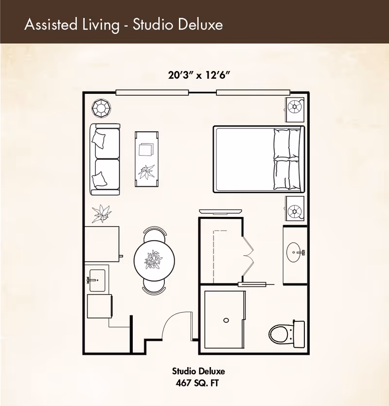 Top-down floor plan of a Studio Deluxe assisted living apartment showing a bed, living area with sofa and table, kitchenette, bathroom, closet, and dimensions (467 sq. ft.).