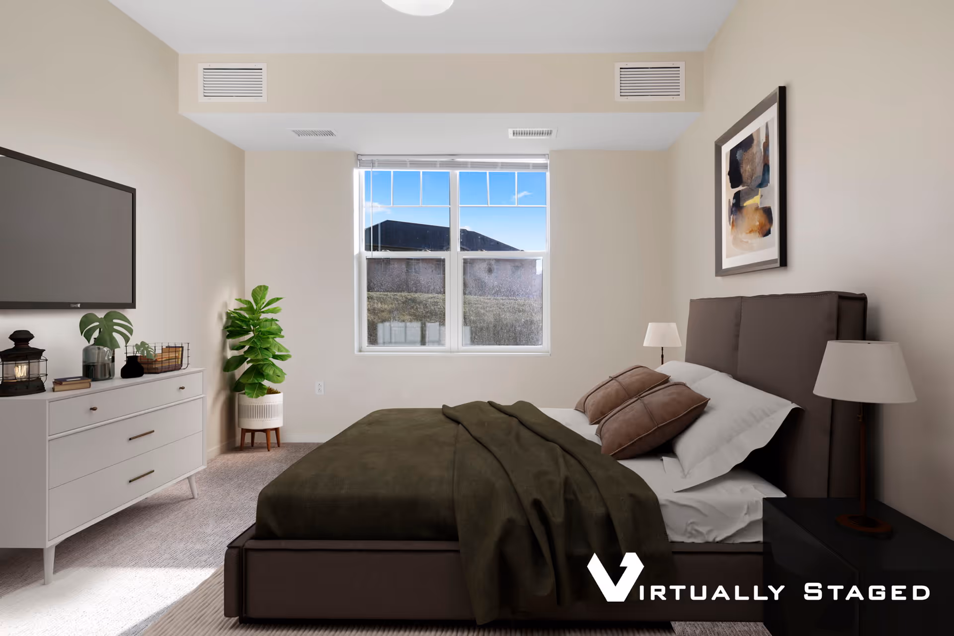 A neatly arranged bedroom with a large bed featuring a dark brown headboard, white sheets, brown pillows, and a dark green blanket. There are two bedside tables with lamps on either side of the bed. A white dresser with decorative items and a flat-screen TV mounted above it is on the left side of the room. A green potted plant is placed in the corner near a window that shows an outdoor view. The walls are painted beige, and a framed abstract painting hangs above the bed.