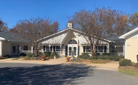 TerraBella Shelby exterior of a senior living facility with entrance arch.