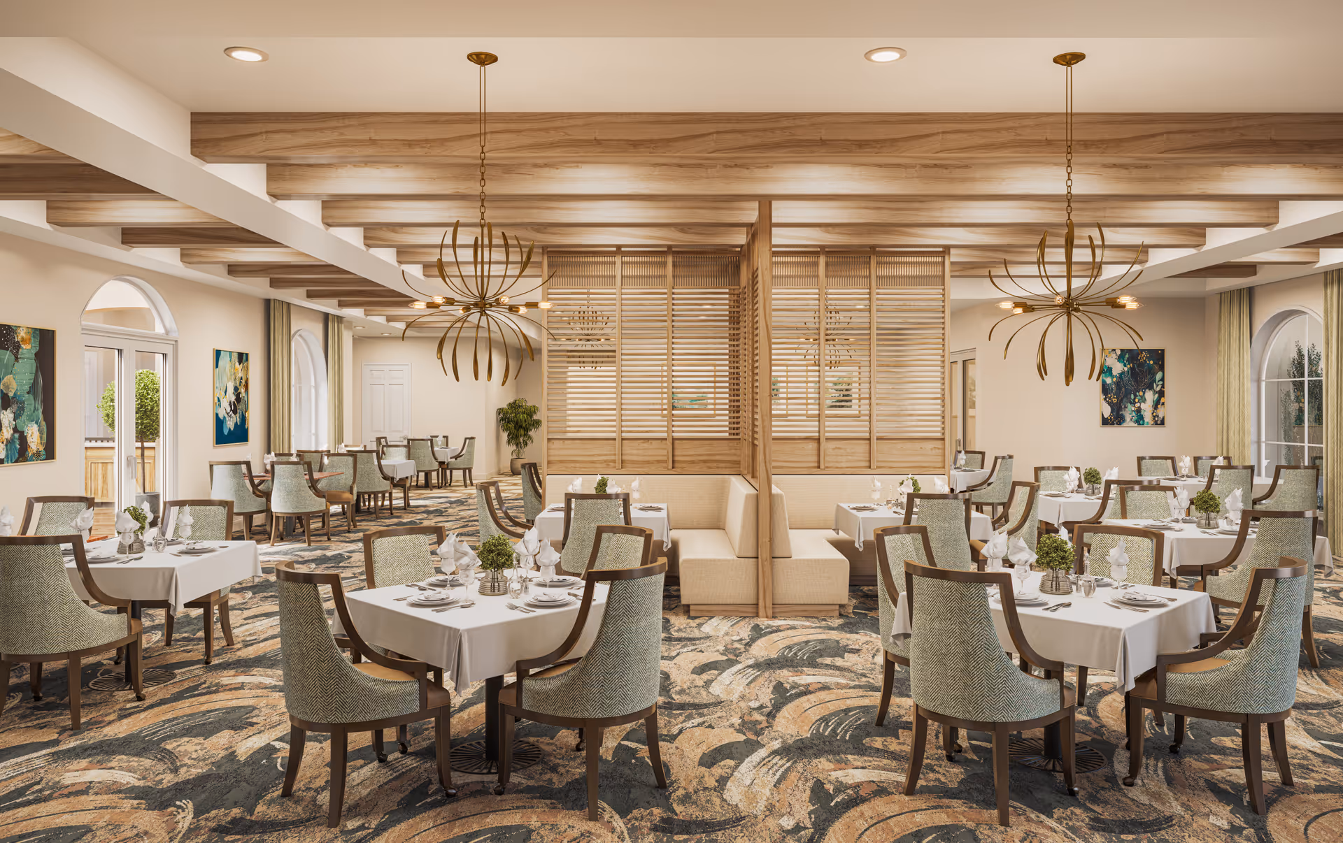 A spacious, elegant dining room with multiple tables covered in white tablecloths, each set with plates, glasses, and napkins. The room features patterned carpet, wooden ceiling beams, modern chandeliers, and decorative wooden partitions separating booth seating areas. Large arched windows and artwork adorn the walls, allowing natural light to brighten the space.