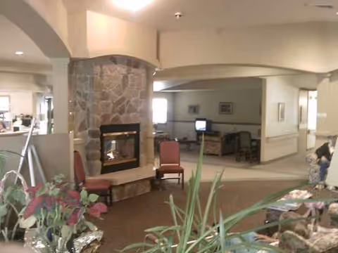 Interior lobby of Diamond Peak Health Care featuring a stone fireplace and seating area.