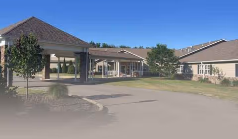 Exterior view of Saybrook Landing Health and Rehabilitation with a covered entrance and driveway.