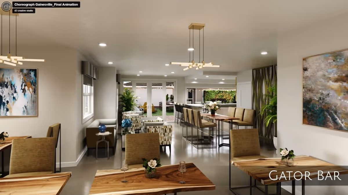 Interior view of a modern lounge and bar area named Gator Bar, featuring wooden tables with chairs, a long bar counter with high stools, comfortable armchairs, decorative plants, abstract wall art, and large windows leading to an outdoor space.