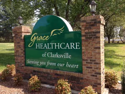 Green sign reading Grace Healthcare of Clarksville on brick pillars outdoors
