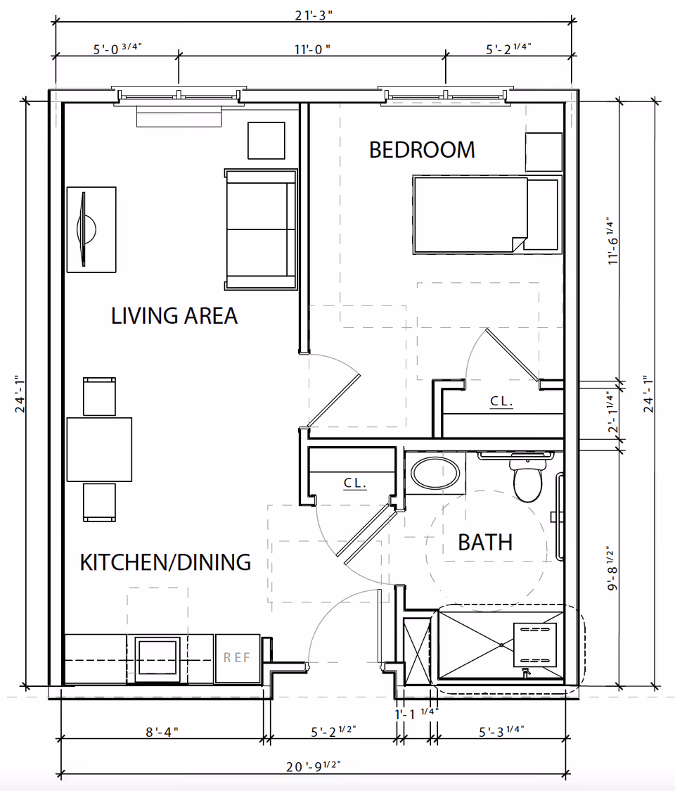 Architectural floor plan of a living space at Oasis at 56th showing a living area with furniture, a kitchen/dining area with a table and refrigerator, a bedroom with a bed and closet, and a bathroom with a sink, toilet, and shower.