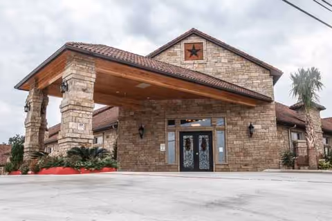 Heritage Creek Assisted Living entrance with stone exterior and covered porte-cochère.