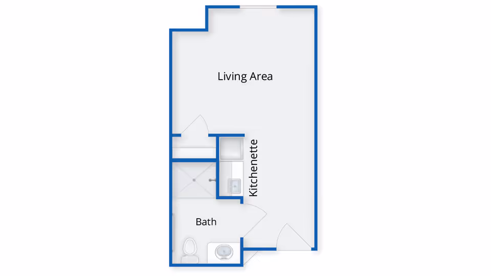 Floor plan layout showing a living area, kitchenette, and bathroom with a shower, toilet, and sink.