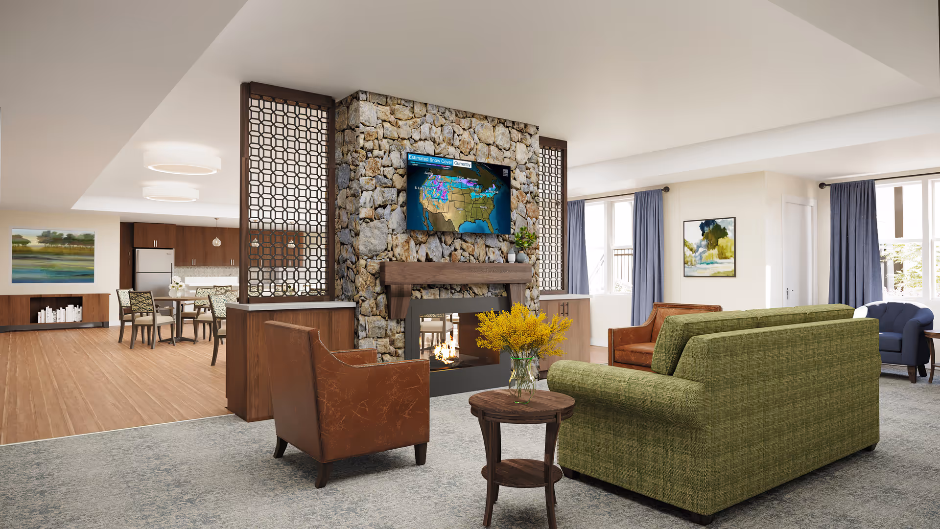 Spacious communal living area with sofas and armchairs arranged around a stone fireplace and wall-mounted TV, with a dining area and kitchenette visible in the background.