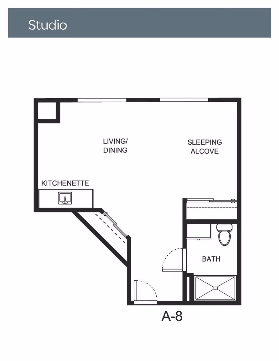 Floor plan labeled Studio showing a layout with a kitchenette, living/dining area, sleeping alcove, and a bathroom with a shower, toilet, and sink.
