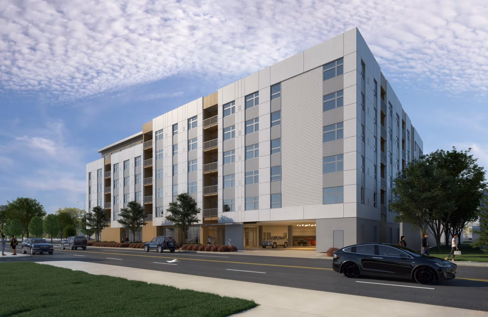 Modern multi-story senior living building front with parked cars, trees, and a partly cloudy sky.