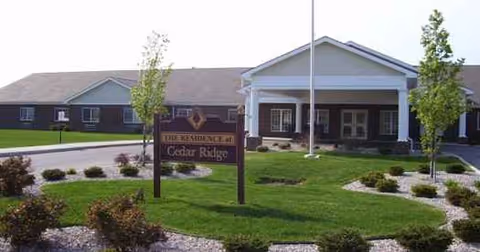 Front view of Cedar Ridge Health Campus with sign, entrance, and manicured landscaping.